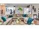 Cozy living room featuring a comfortable sofa, a glass-topped coffee table, and stylish decor at 6990 Annie Walk, Lithonia, GA 30038