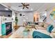 The living room features a cozy fireplace, ceiling fan, and comfortable seating at 6990 Annie Walk, Lithonia, GA 30038