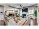 Open-concept living room flowing into the kitchen, featuring a fireplace and modern decor at 6990 Annie Walk, Lithonia, GA 30038