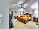 Spacious main bedroom featuring a ceiling fan, large windows and neutral carpet at 6990 Annie Walk, Lithonia, GA 30038
