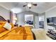 Main bedroom features high ceilings, neutral walls, and a peek into the living room at 6990 Annie Walk, Lithonia, GA 30038