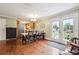 Bright dining area with french doors and an adjacent, modern kitchen at 815 Tanner Rd, Dacula, GA 30019