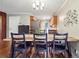 The dining area features hardwood floors and a decorative wall art at 815 Tanner Rd, Dacula, GA 30019
