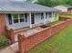 View of a lovely single-story home with a brick facade and well-manicured landscaping at 815 Tanner Rd, Dacula, GA 30019