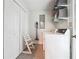 Functional laundry room with washer, dryer, storage shelves, and convenient access at 815 Tanner Rd, Dacula, GA 30019