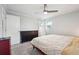 Spacious bedroom with a ceiling fan, a dresser, and an ensuite bathroom at 815 Tanner Rd, Dacula, GA 30019