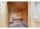 Inviting wooden sauna with a bench, soft lighting, and a colorful rug at 815 Tanner Rd, Dacula, GA 30019