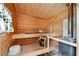 Relaxing sauna room featuring natural wood finish and traditional sauna accessories at 815 Tanner Rd, Dacula, GA 30019