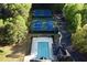 Aerial view of community pool and tennis courts surrounded by lush trees and well-maintained landscaping at 1405 Wilmington Way, Grayson, GA 30017
