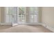 A bedroom's private outdoor wooden balcony with shuttered french doors for easy access at 1405 Wilmington Way, Grayson, GA 30017