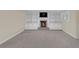 Finished basement with a fireplace surrounded by built in shelving at 1405 Wilmington Way, Grayson, GA 30017