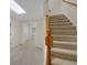 Basement featuring neutral walls and carpet with multiple doorways and wooden banister at 1405 Wilmington Way, Grayson, GA 30017