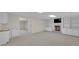Finished basement area with fireplace, built-in shelving, wet bar, and neutral carpet at 1405 Wilmington Way, Grayson, GA 30017