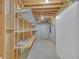 Unfinished basement storage area with exposed rafters at 1405 Wilmington Way, Grayson, GA 30017