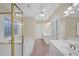 Bathroom boasts double vanities, shower, soaking tub, and decorative window at 1405 Wilmington Way, Grayson, GA 30017