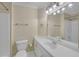 Bathroom featuring a shower and large vanity with patterned wallpaper at 1405 Wilmington Way, Grayson, GA 30017