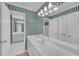 Bathroom with and sinks, vanity with framed mirror, and plenty of cabinet space at 1405 Wilmington Way, Grayson, GA 30017