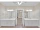 Large bathroom with dual sink vanities, framed mirrors, and pink tile flooring at 1405 Wilmington Way, Grayson, GA 30017