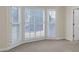Bedroom featuring neutral walls and carpet with a bay window and white trim at 1405 Wilmington Way, Grayson, GA 30017