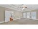 Large carpeted bedroom with access to a private balcony at 1405 Wilmington Way, Grayson, GA 30017