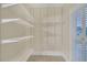 Walk-in closet featuring a custom white shelving system at 1405 Wilmington Way, Grayson, GA 30017