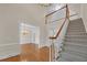 Spacious foyer featuring hardwood floors, a staircase, and an ornate chandelier, offering a grand entrance at 1405 Wilmington Way, Grayson, GA 30017