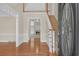 Bright foyer with hardwood floors, staircase, and views into adjacent rooms, creating an inviting entrance at 1405 Wilmington Way, Grayson, GA 30017