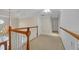 Second story hallway with a view of the foyer and a beautiful chandelier at 1405 Wilmington Way, Grayson, GA 30017
