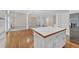 Well lit open-concept kitchen with an island, stainless appliances, and an open floor plan at 1405 Wilmington Way, Grayson, GA 30017