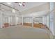 Spacious living room with great natural light and an open floor plan connecting to the kitchen at 1405 Wilmington Way, Grayson, GA 30017