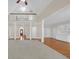 Spacious living room with hardwood floors, white columns, and a view of the second story landing at 1405 Wilmington Way, Grayson, GA 30017