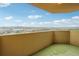Condo balcony overlooking mature trees and a blue sky with white fluffy clouds at 1501 Clairmont Rd # 1624, Decatur, GA 30033