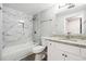 Bathroom features white marble tiled shower, granite vanity, and white cabinets at 1501 Clairmont Rd # 1624, Decatur, GA 30033