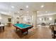 Large recreation room with a billiard table, couches, and tables at 1501 Clairmont Rd # 1624, Decatur, GA 30033