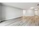 Spacious living room with contemporary gray wood flooring and neutral decor for a flexible design at 1501 Clairmont Rd # 1624, Decatur, GA 30033