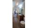 Well-lit bathroom featuring double sinks, linoleum floors, and a separate toilet area at 237 Summergate Ln, Villa Rica, GA 30180