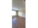 Bright bedroom with hardwood floors and a large window with natural light; spacious and well-lit at 237 Summergate Ln, Villa Rica, GA 30180