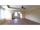 Bright bedroom featuring wood floors, a ceiling fan, and a unique window nook at 237 Summergate Ln, Villa Rica, GA 30180