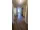 Hallway with hardwood floors leading to rooms; natural light fills the area at 237 Summergate Ln, Villa Rica, GA 30180