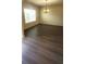 Open living area featuring ample natural light and modern chandelier at 237 Summergate Ln, Villa Rica, GA 30180