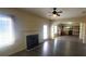 Comfortable living room with a fireplace, large windows and seamless transition to the kitchen at 237 Summergate Ln, Villa Rica, GA 30180