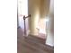 Carpeted staircase with dark wood railing transitioning to wood-look flooring at 237 Summergate Ln, Villa Rica, GA 30180