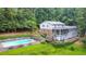 Expansive backyard featuring a private pool, lush greenery, and a screened porch, ideal for outdoor living at 2940 Blue Sky Pl, Marietta, GA 30068