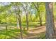 A peaceful backyard with mature trees and an expansive, well-maintained lawn at 2940 Blue Sky Pl, Marietta, GA 30068