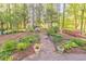 Beautiful garden with flowers and landscaping adds charm to this backyard retreat at 2940 Blue Sky Pl, Marietta, GA 30068