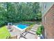 Beautiful backyard with pool, patio area, and lush landscaping, perfect for entertaining at 2940 Blue Sky Pl, Marietta, GA 30068
