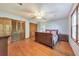 This bedroom is well lit, has hardwood floors, two closets, and large window for natural lighting at 2940 Blue Sky Pl, Marietta, GA 30068