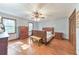 This spacious bedroom includes a queen size bed, hard wood floors and lots of natural lighting at 2940 Blue Sky Pl, Marietta, GA 30068