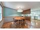 Cozy dining area with wood floors, table for six, and a view of the backyard at 2940 Blue Sky Pl, Marietta, GA 30068