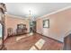 Elegant dining room with hardwood floors, a chandelier, and classic decor, perfect for formal gatherings at 2940 Blue Sky Pl, Marietta, GA 30068